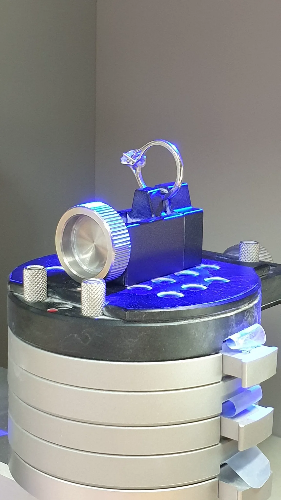 An engagement ring positioned inside the precision scanning machine
